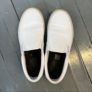 vans classic leather slip ons in white.